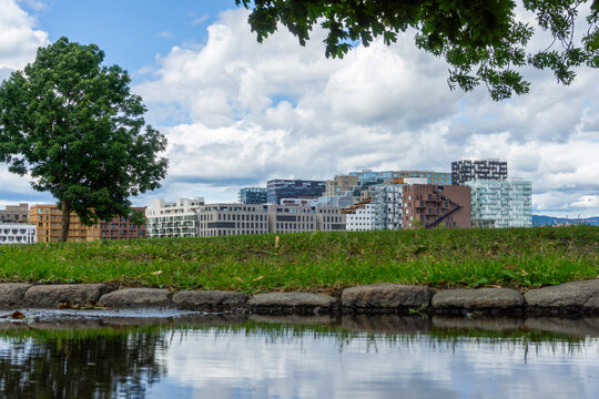 Oslo Barcode district reflecting in park pond water