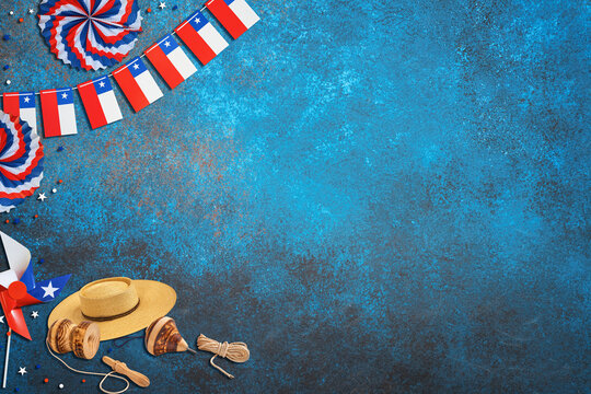 Chile fiestas patrias decorations and traditional toys on a blue background with copy space