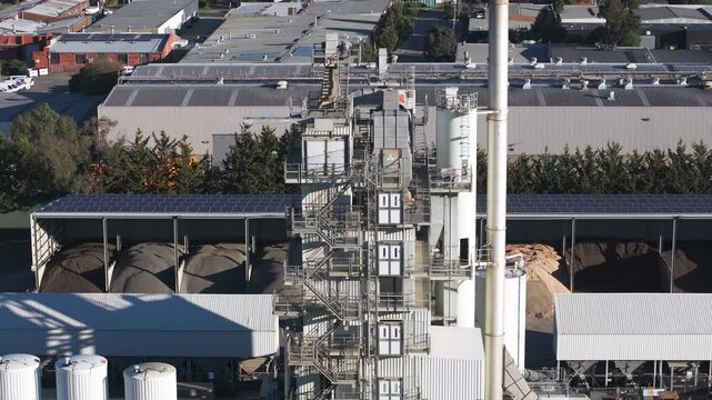 Aerial view of a concrete plant tower and industrial complex