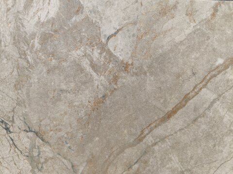 Close up of grey marble quartzite texture with dramatic rusty stone veins background
