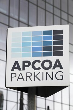 Copenhagen, Denmark - November 13, 2021: APCOA Parking logo on a signboard. APCOA Parking AG is Europe's longest-established full service parking management company