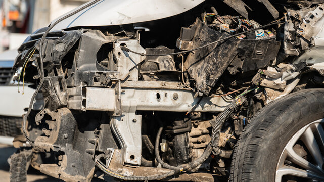 Damaged Vehicle Wheel Well and Front Axle Frame After Car Accident