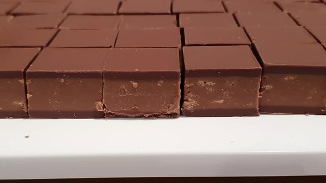 Horizontal camera movement over gourmet chocolate praline bonbon.