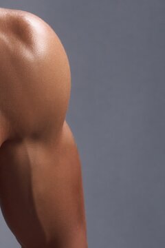 Close-up of a muscular shoulder and arm showing defined deltoid and bicep.