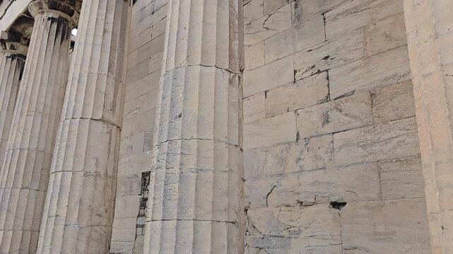 Athens, Greece - 8 July 2026. Low Angle View inside the Temple of Hephaestus in the Ancient Agora, with Doric Marble - Rock columns, entablature, inner stone material wall, roof opening, and Overcast 