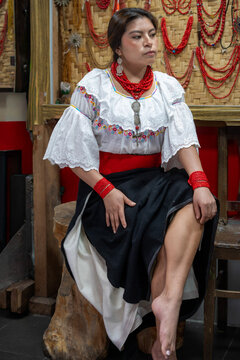 Woman in traditional dress with red bead jewelry reflection