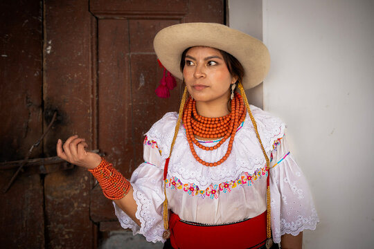 Indigenous woman in traditional dress with bead necklace