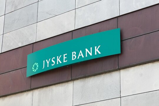 Nykobing, Denmark - June 12, 2016: Jyske Bank sign on a wall. Jyske bank is the third largest Danish bank in terms of market share