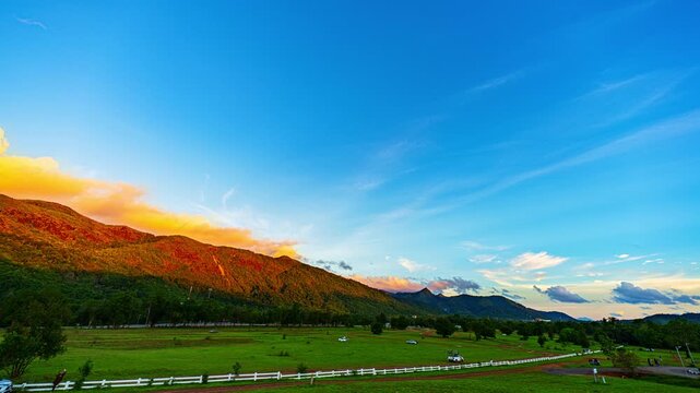 Time lapse A serene countryside scene displaying untouched wilderness, layered mountain ranges, and clouds that create depth and visual impact. Vast Green Landscape Stretching to the Horizon in Ranong
