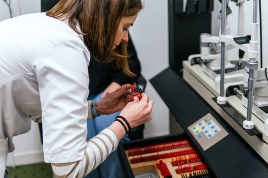 Woman prepare ophthalmic equipment for eye examination