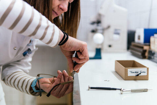 Optician repair eyeglass frame with precision screwdriver
