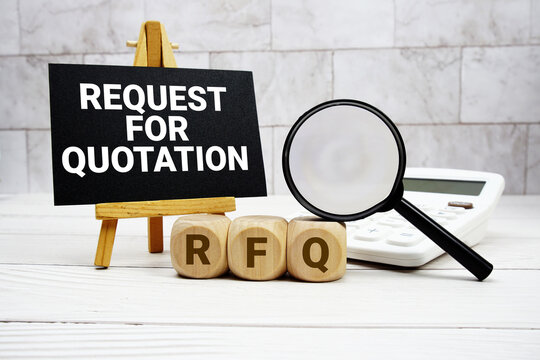RFQ Request For Quotation text with calculator magnifying glass and on wooden background