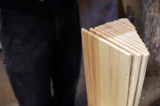 Stack of handcrafted spruce wooden shingles (tavaillons) ready for traditional roofing in the Haut-Jura, France