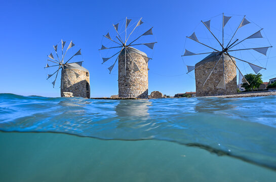 Split level underwater image of historical windmills of Chios Island, Greece with space for your text