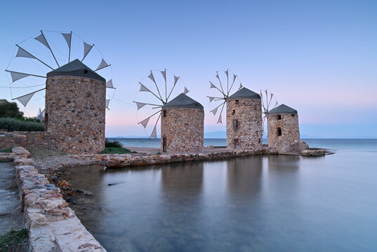Ancient windmills of Chios Island, Greece at sunset 