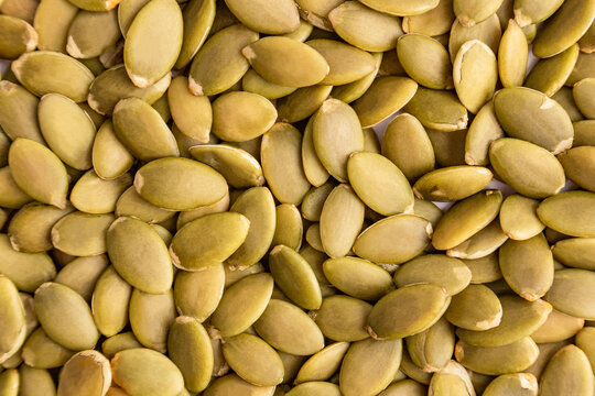 Close-up background of raw pumpkin seed food texture