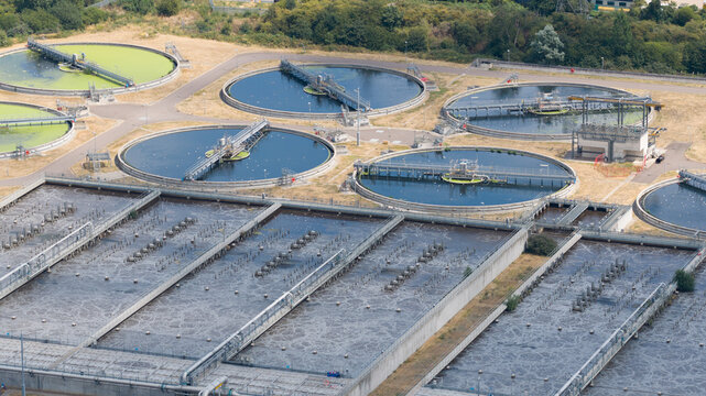 Aerial view of wastewater treatment plant with clarifier tanks