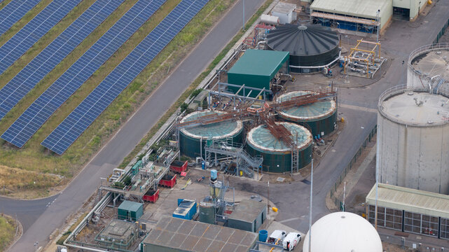 Aerial view of wastewater treatment plant with solar panels