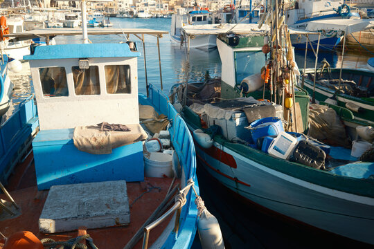 Colorful fishing boats moored in Favignana harbor