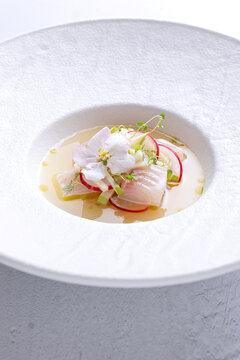 Peruvian fish ceviche with radish and edible flower