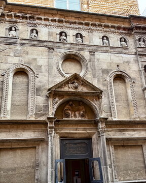 Ancient Stone Relief Entrance Facade of Chiesa dei Filippini Church in Bologna Italy for Historical Background