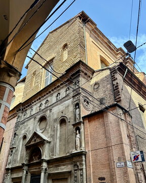 Low Angle View of Historic Brick Church Exterior Wall and Blue Sky in Bologna Italy for City Travel Guide