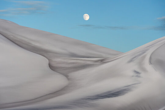 Moon above Saujil Dunes in Catamarca, Argentina desert