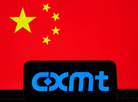 CXMT logo displayed on a smartphone against the national flag of China in a semiconductor industry illustration. Stafford, United Kingdom, August 2, 2026.