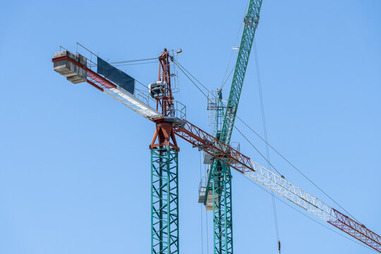Tower crane and concrete formwork against clear blue sky