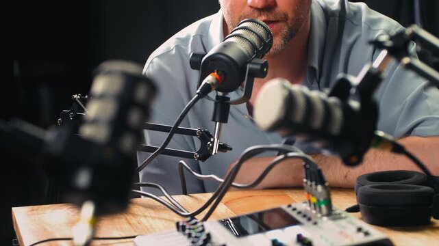 Podcast Live streaming, man radio presenter with microphone, talk show or entertainment. Content creator podcast host in studio for recording audio social media, live concert show. 