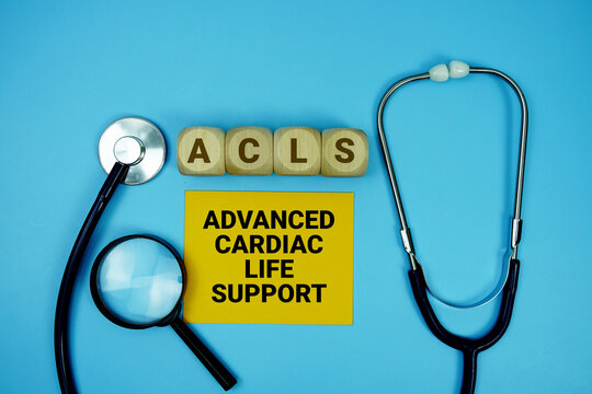 Advanced Cardiac Life Support (ACLS)  text with stethoscope and magnifying glass on blue background