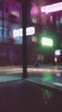A street in a city is filled with bright neon lights. The reflection on the ground shows a wet surface from recent rain. People walk in the background, adding life to the scene.