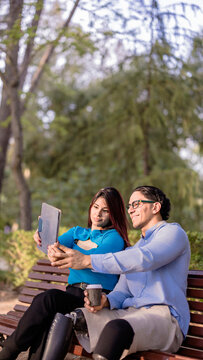 People using digital tablet with prosthetic legs