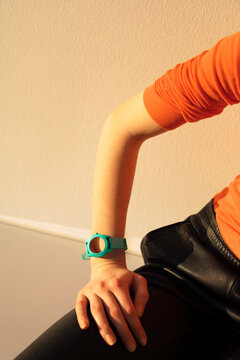 Person wearing wristwatch, symbol of time and patience