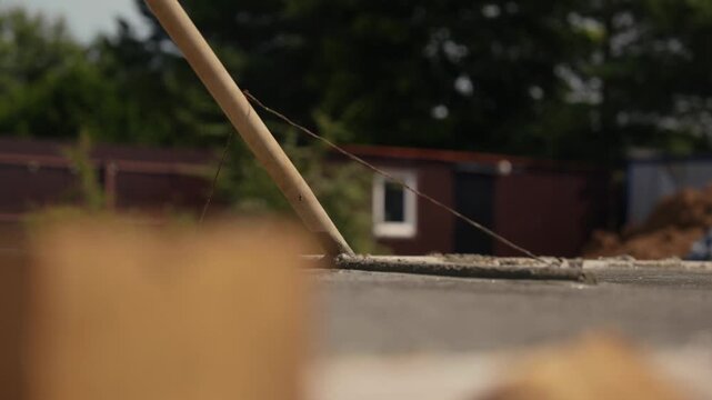 Hot summer day creating a heat haze effect on a residential rooftop with a blurred background of trees and a small building, conveying a sense of intense warmth and atmospheric distortion