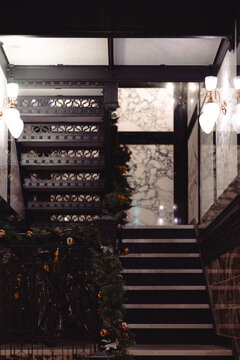A stylish staircase featuring beautiful marble finishes and elegant lighting, showcasing architectural sophistication and creating a luxurious ambiance.