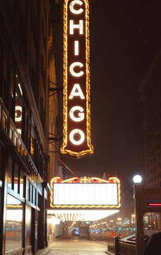A close-up shot of the iconic Chicago theater marquee offers a glimpse of the charming lights and bold design that represent the city's vibrant arts and entertainment scene.