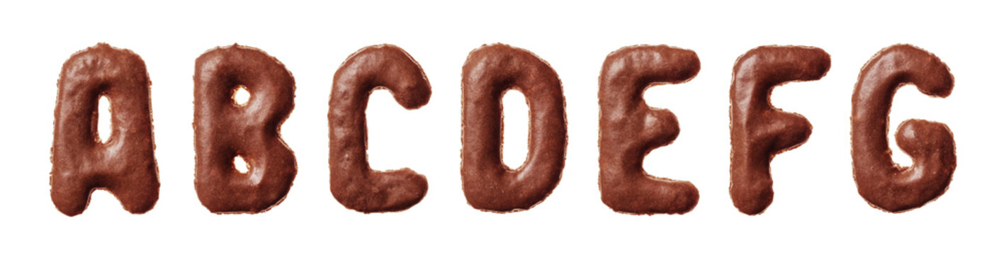 First seven letters of the alphabet A to G shaped as chocolate glazed cookies lined up horizontally on a pure white background