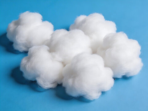 White cotton balls on blue surface