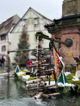Eguisheim, France - December 7, 2025: Wooden Fountain Decoration Shaped Like a Christmas Tree