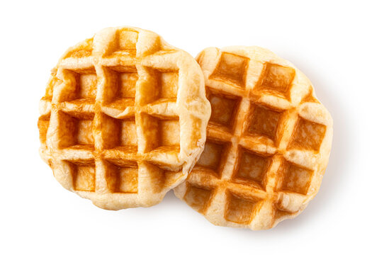 Top view of two freshly baked, golden brown Belgian waffles isolated on white background. for breakfast menus, bakery advertisements, and sweet dessert concepts.