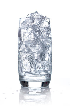 Glass filled with crystal clear water and plenty of ice cubes, isolated on a white background . healthy hydration and summer refreshment concepts.
