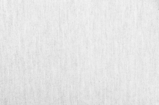 Grey fabric texture with fine weave pattern. minimalist textile background is perfect for fashion design, clothing mockups, and elegant backdrop concepts.