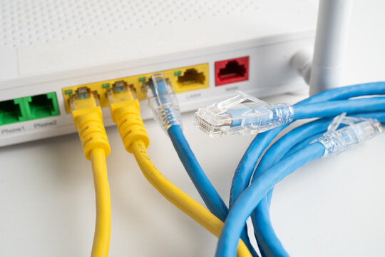 Ethernet cable with wireless router connect to internet service provider internet network.