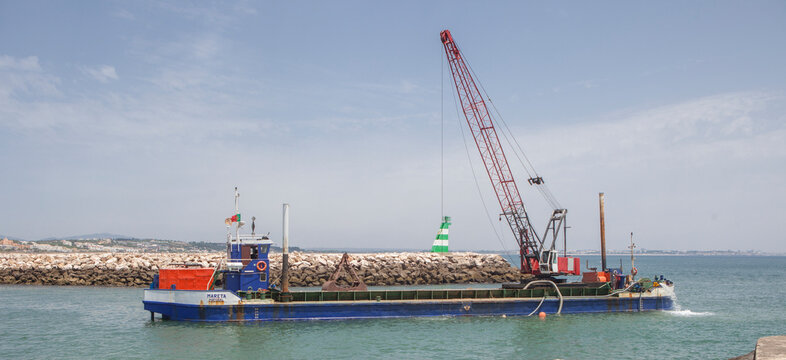 Dredge extracting sand, Lagos, Portugal