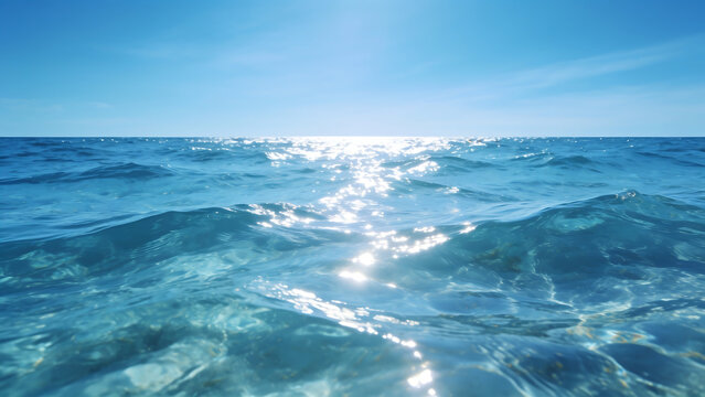 Vast ocean waves glistening under the bright sunlight at horizon.