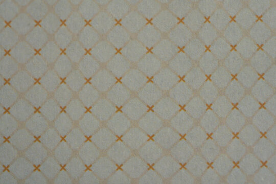 Seamless geometric cross and diamond pattern on off white textured surface
