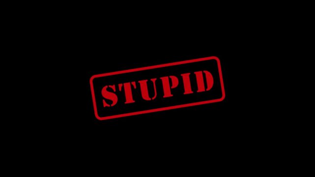 "Stupid" text animation featuring a red ink stamp design&mdash;resembling a grade correction&mdash;against a black background. 4K video.