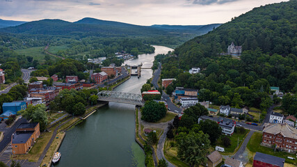 Naklejka premium July 28, 2026 - Whitehall, NY, USA - Aerial image of the village of Whitehall, NY and the Champlain Canal. Whitehall is regarded as the Birthplace of the United States Navy.