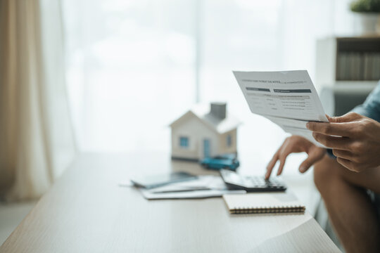 household budget, financial statement, and calculator shape this practical household finance scene. The composition communicates financial awareness, thoughtful choices, and household organization.